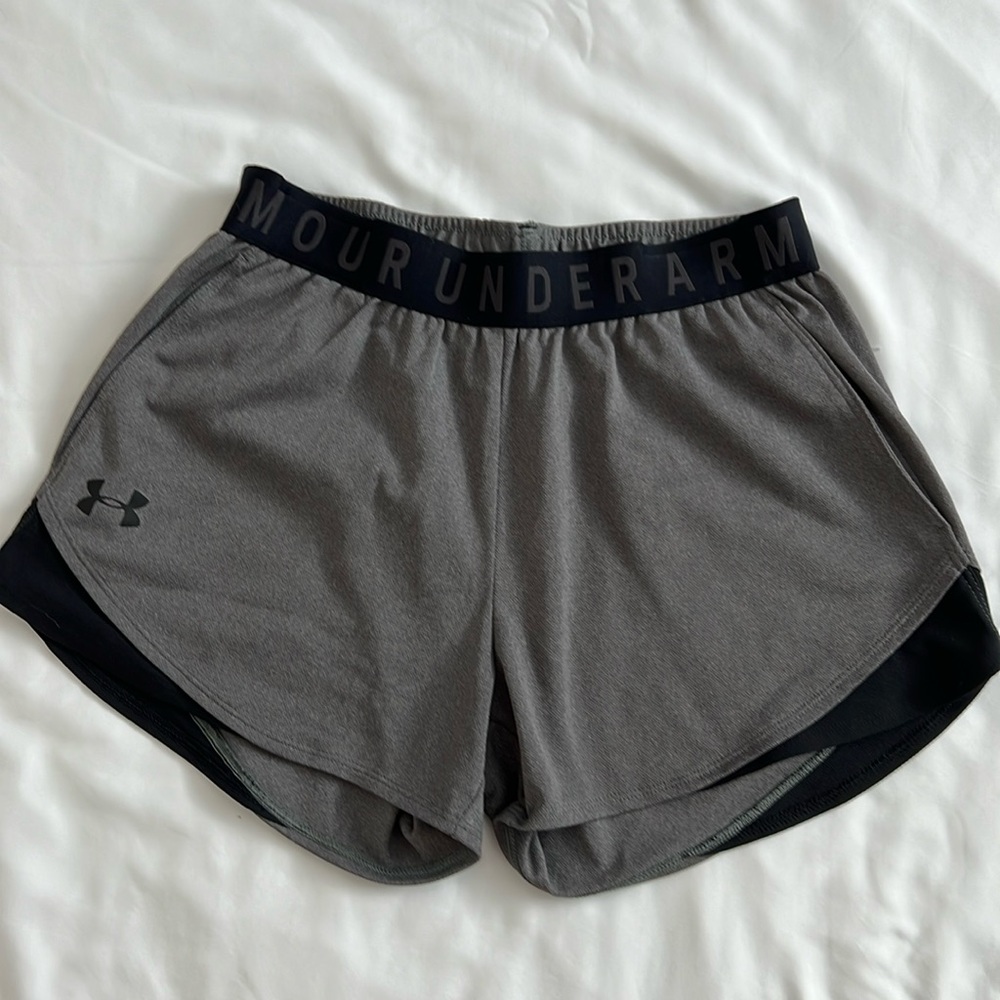 Under Armour women’s athletic shorts, size XS gray and black with pockets.